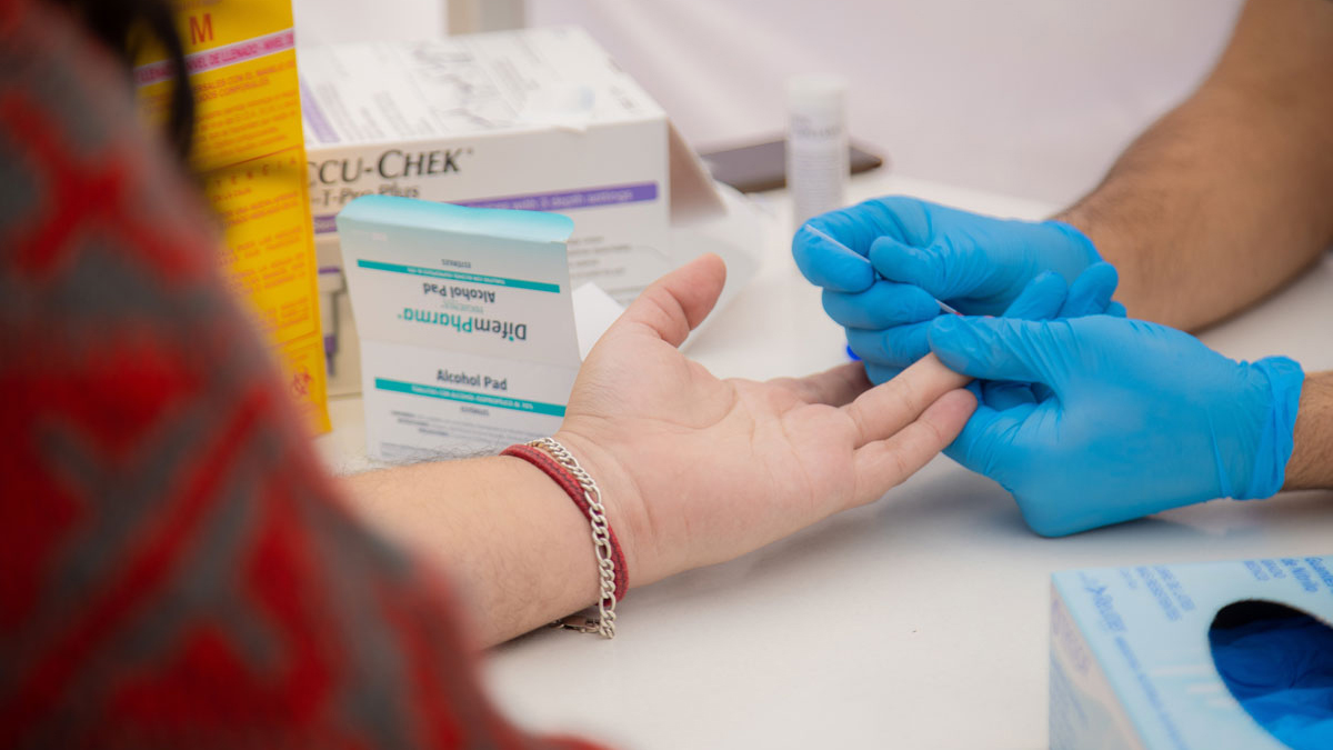 AHF Poland staff conducting an HIV test